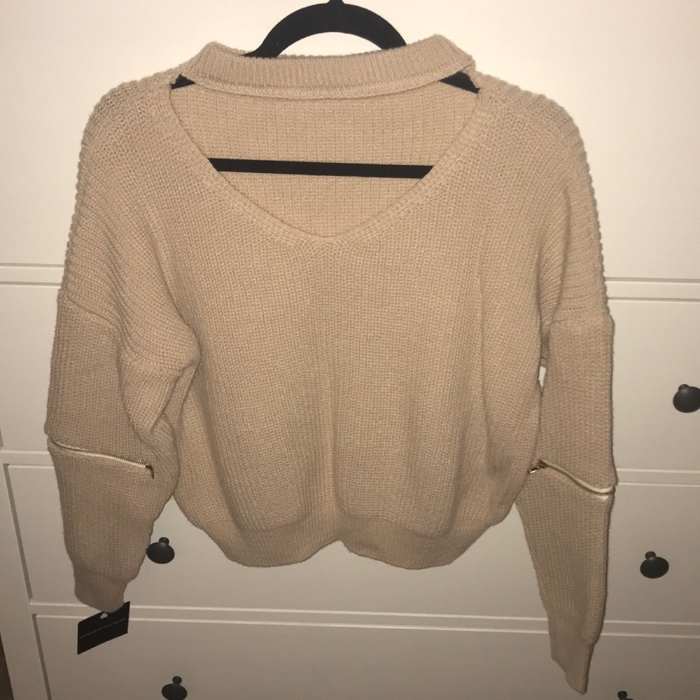 cropped open neck zip elbow sweater