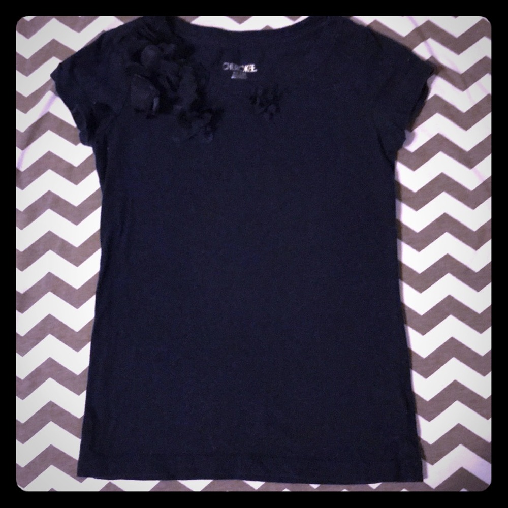 Cherokee top with flower embellishments.