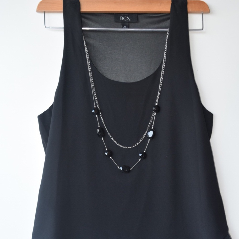 Cute shirt with necklace has a sheer back