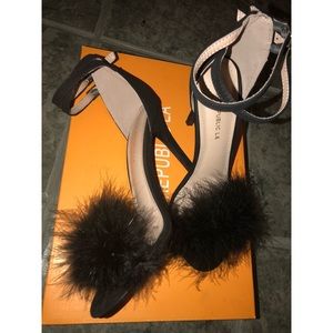 Black feathered dressy shoes