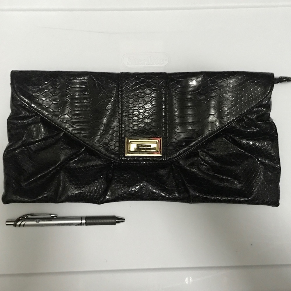 Free with purchase from Closet Black hand clutch
