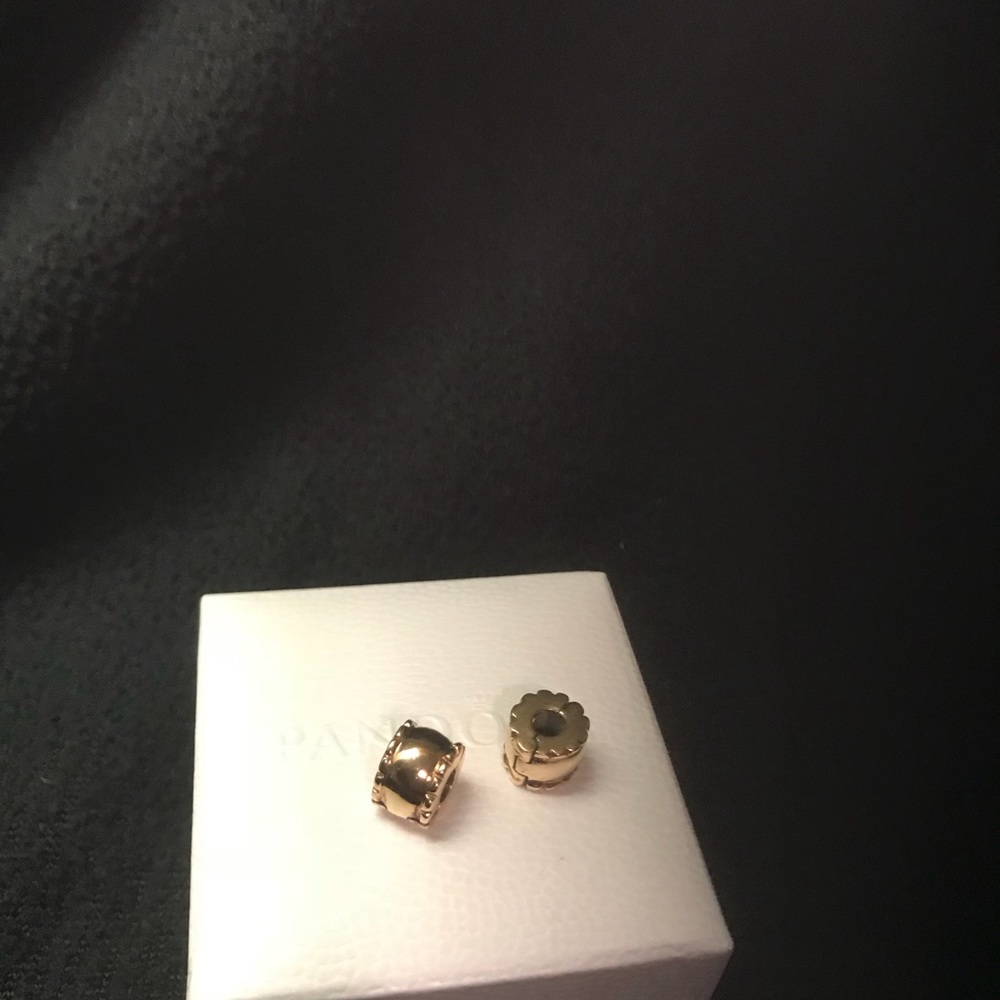 Gold pandora clamps.