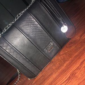Black leather Guess shoulder purse