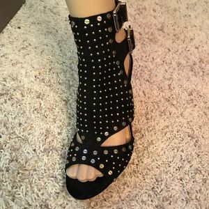 Black and gold wedge shoes