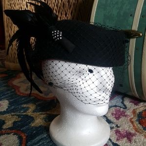 Vintage pillbox hat with feathers and netting