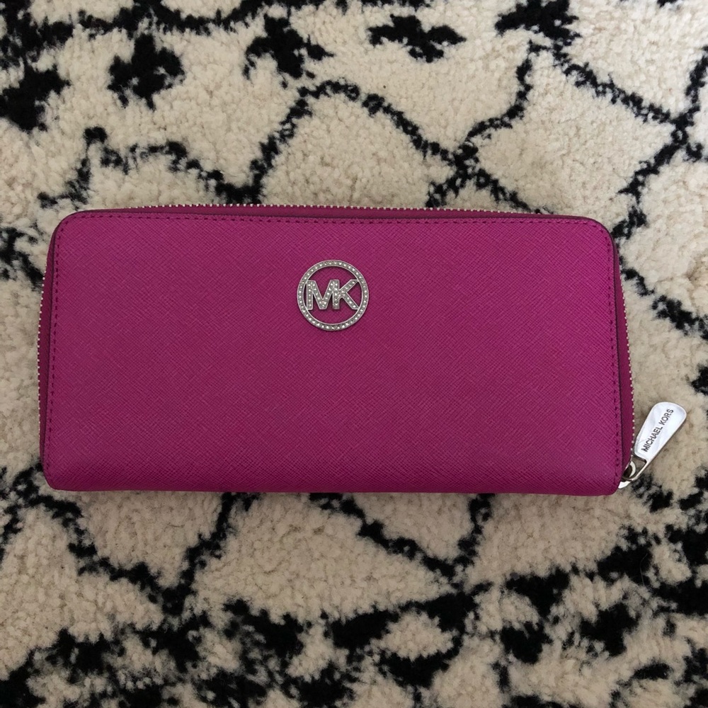 Gorgeous fuchsia zip around wallet with detail!