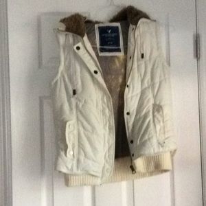 Puffy vest with warm attached hood