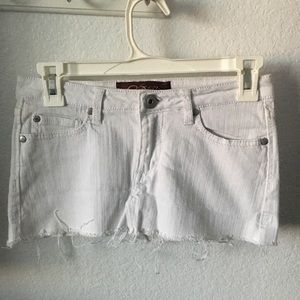 Distressed white denim skirt