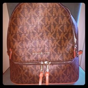 Black/brown with tan straps backpack