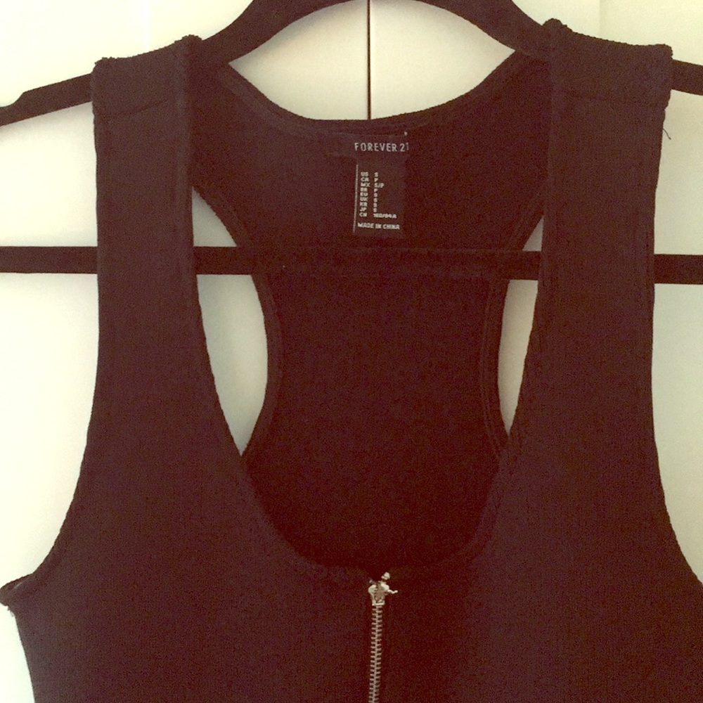 Black dress with zip up the front.