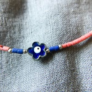 Floral Talisman: Handcrafted South American Bracelet