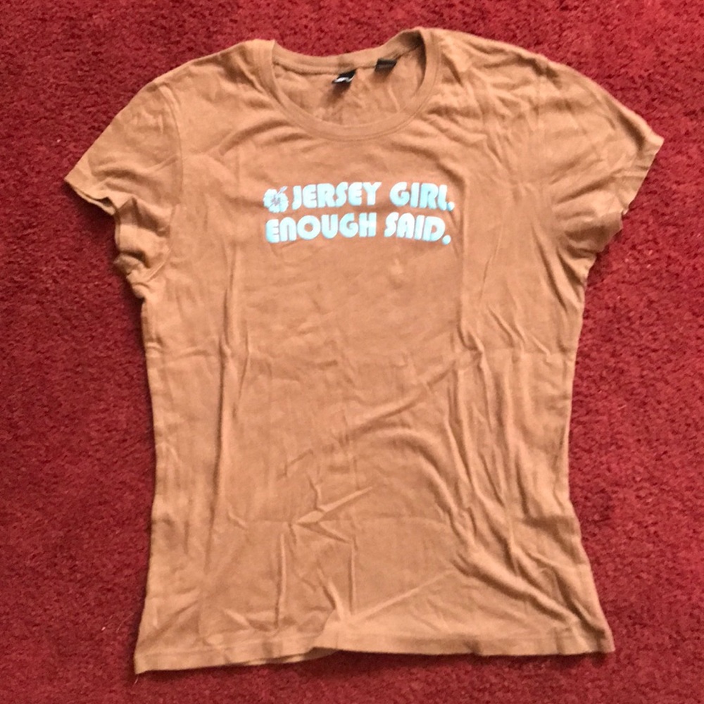 Brown shirt sky blue letters
