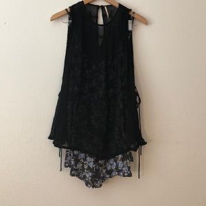 Floral romper with a black filmy tank top