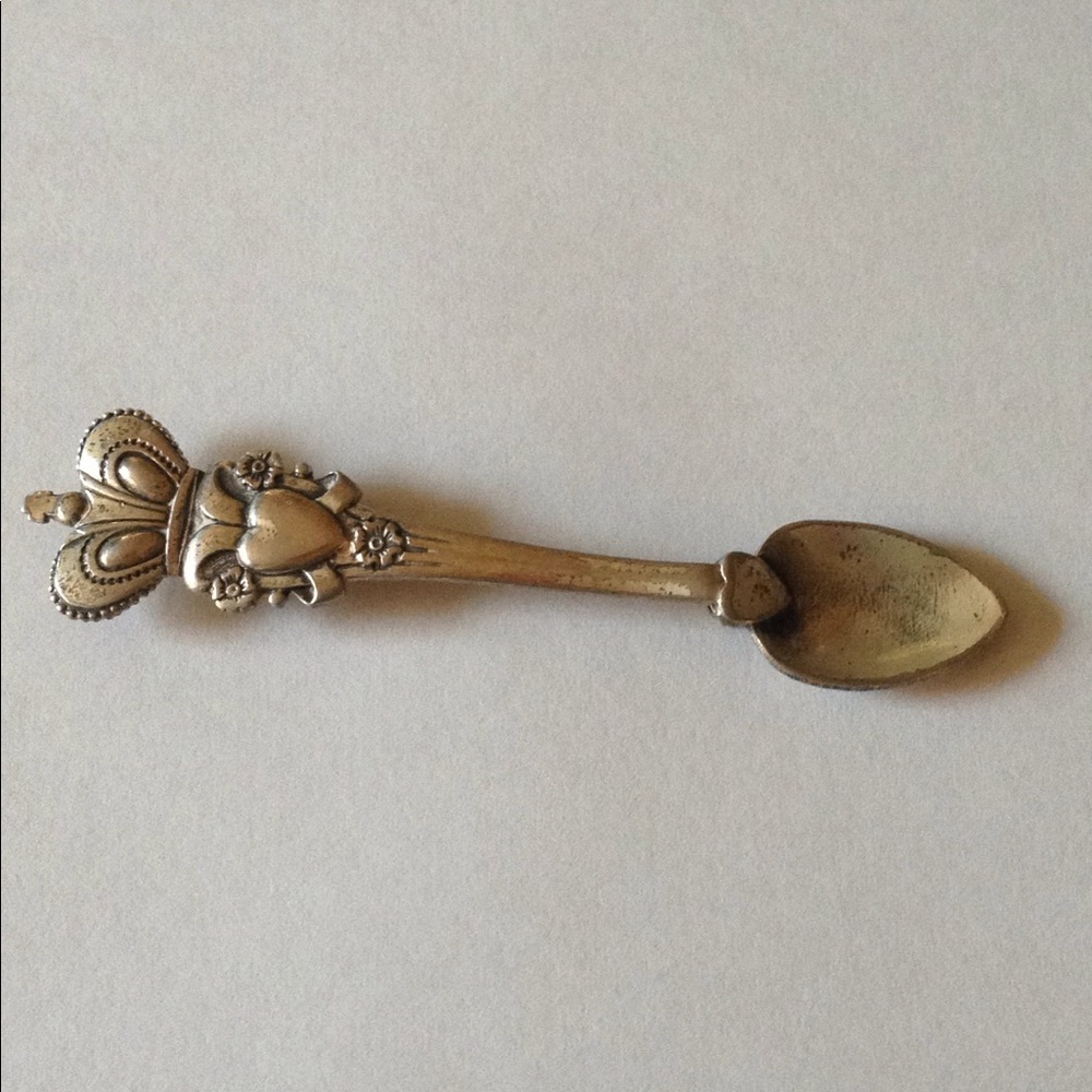 Vintage collectible sterling Cora spoon brooch
