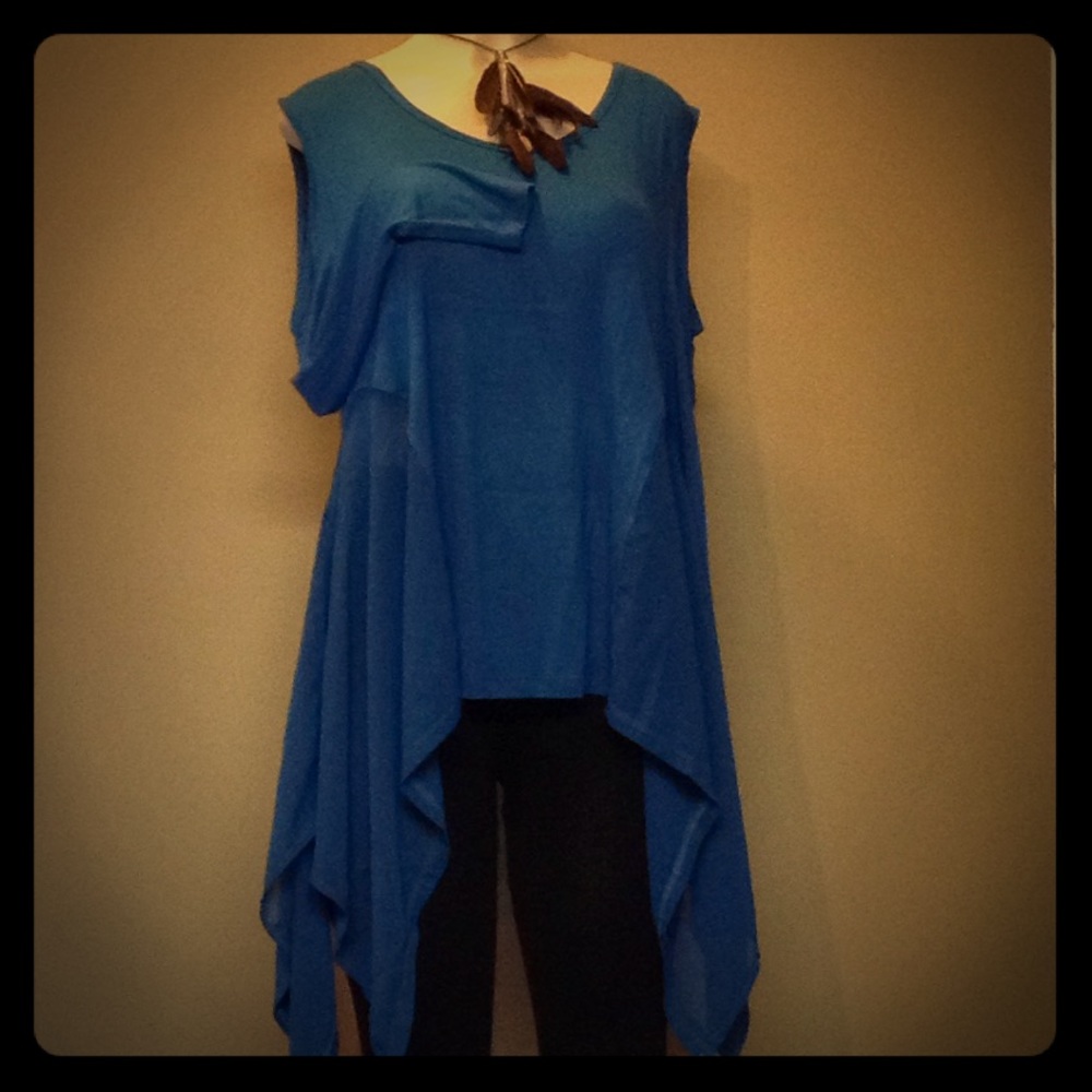 Cold shoulder shark fin top with some sheer panels
