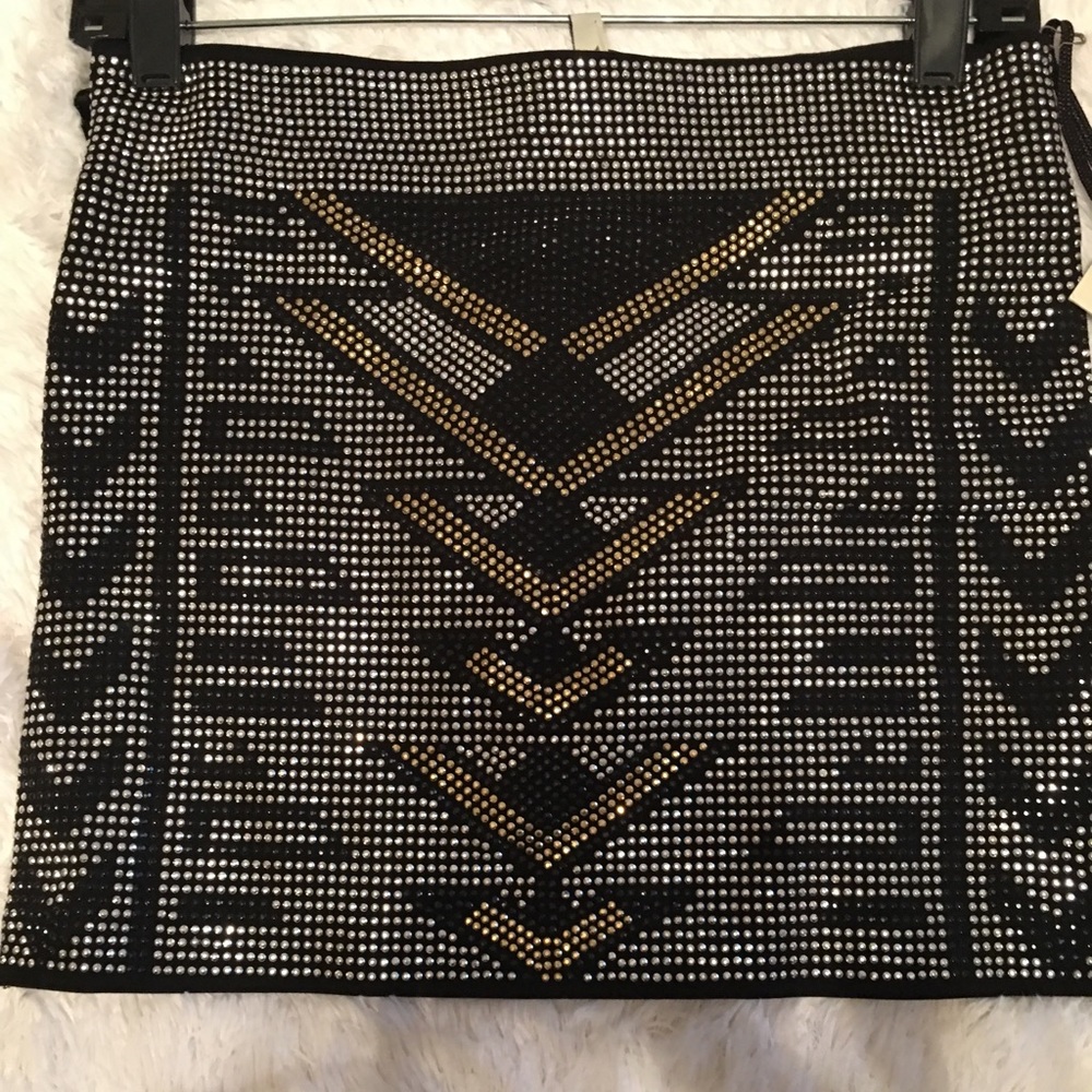 Studded skirt.  Black with silver and gold