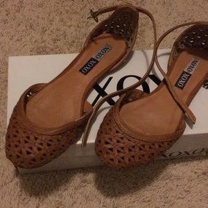 Used flat shoes . Closed toe with a strap