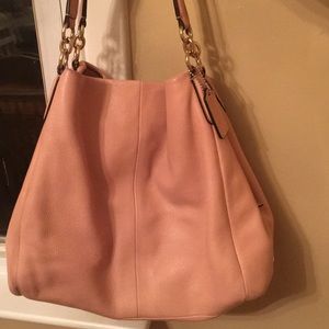 A slightly used coach bag.