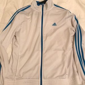 White and blue zip up adidas jacket.
