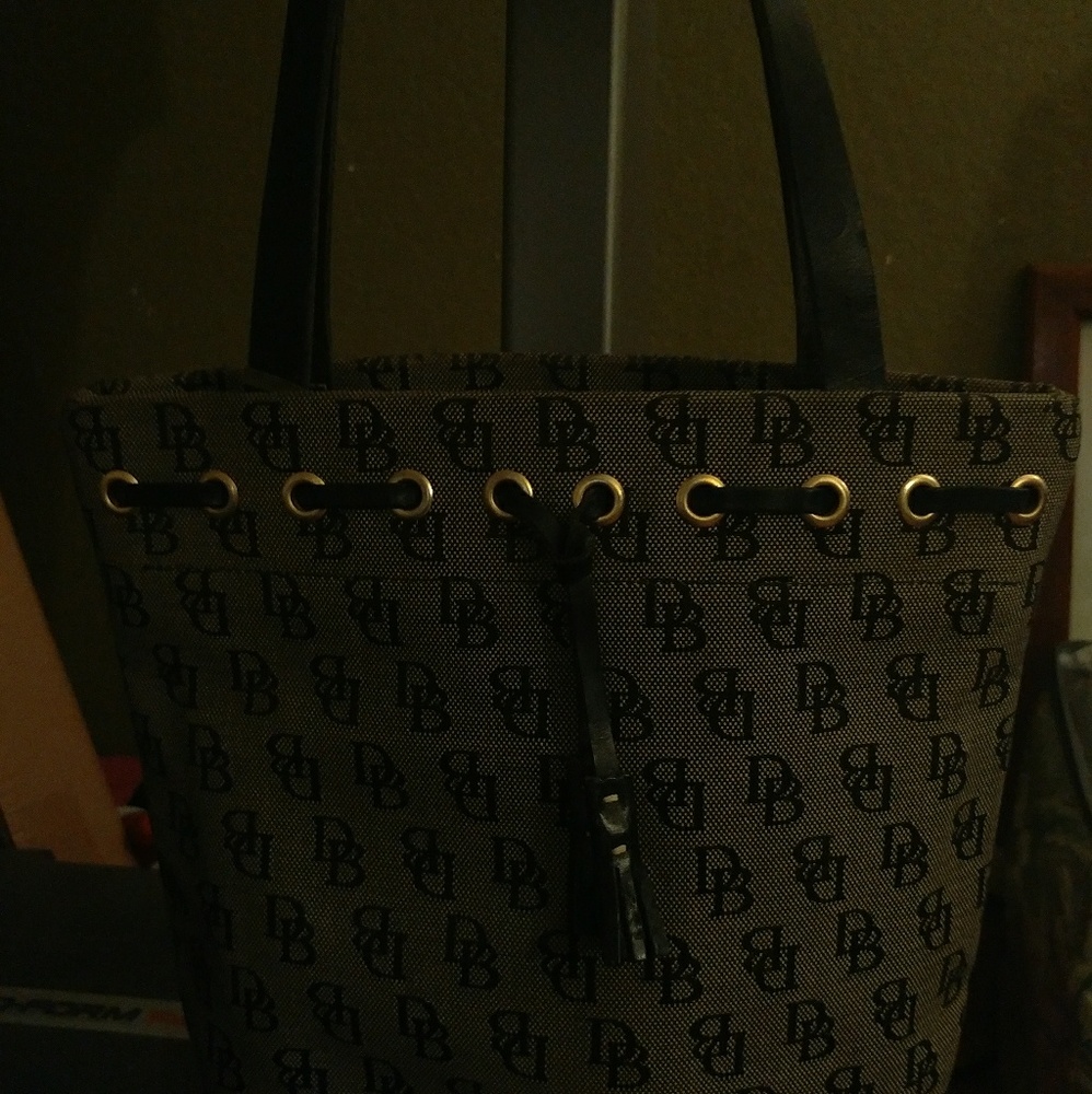 Dooney & Bourke cloth bucket style shoulder purse.