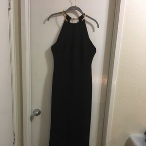 Black full length crepe dress with Gold choker.