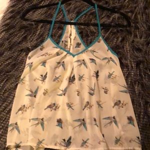 Women’s flowing sheer bird printed top