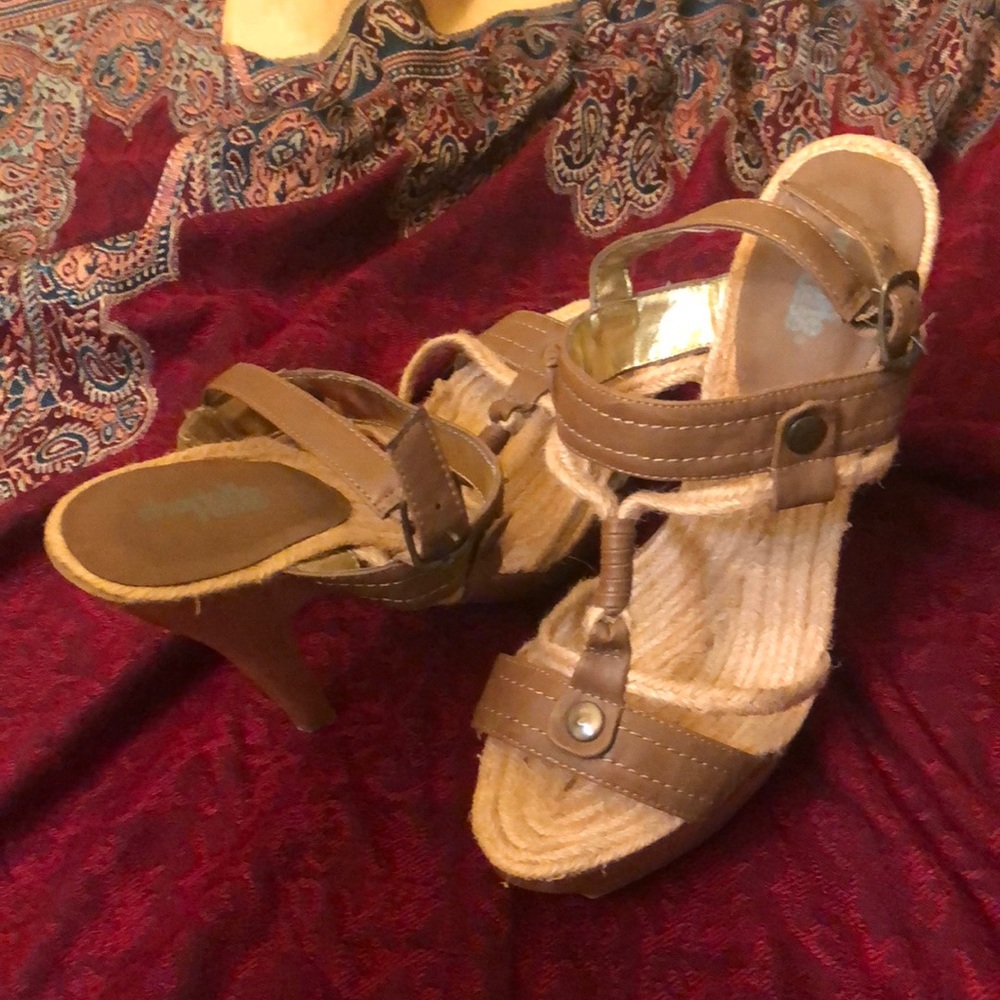 Brown leather and wooden heels