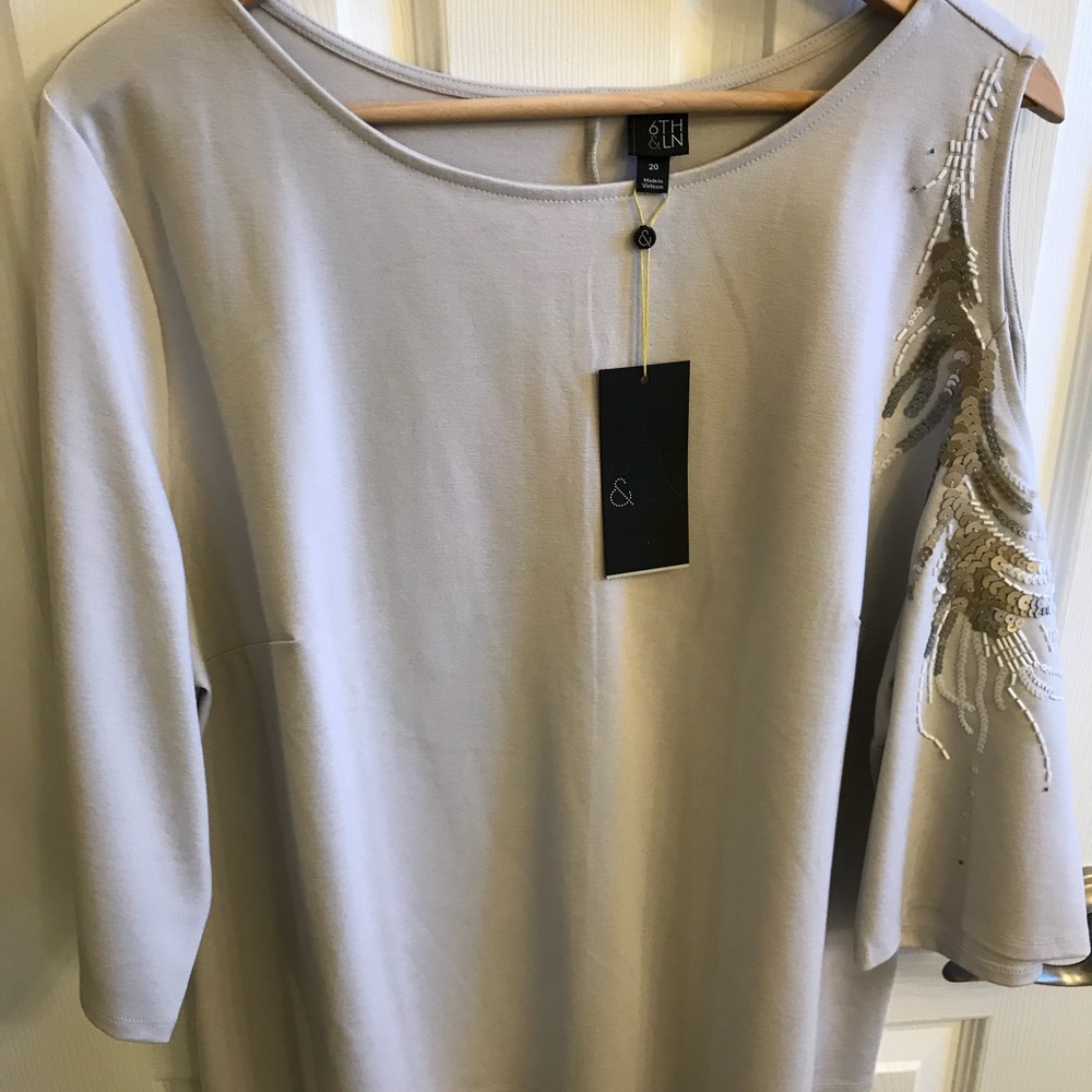Blouse with sequin details. 6th and Lane