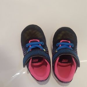 Multicolored girls (toddler) Nike sneakers.