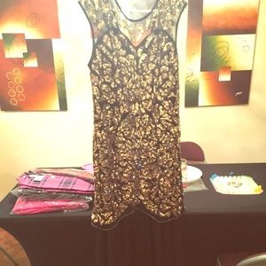 Black and gold sequin dress