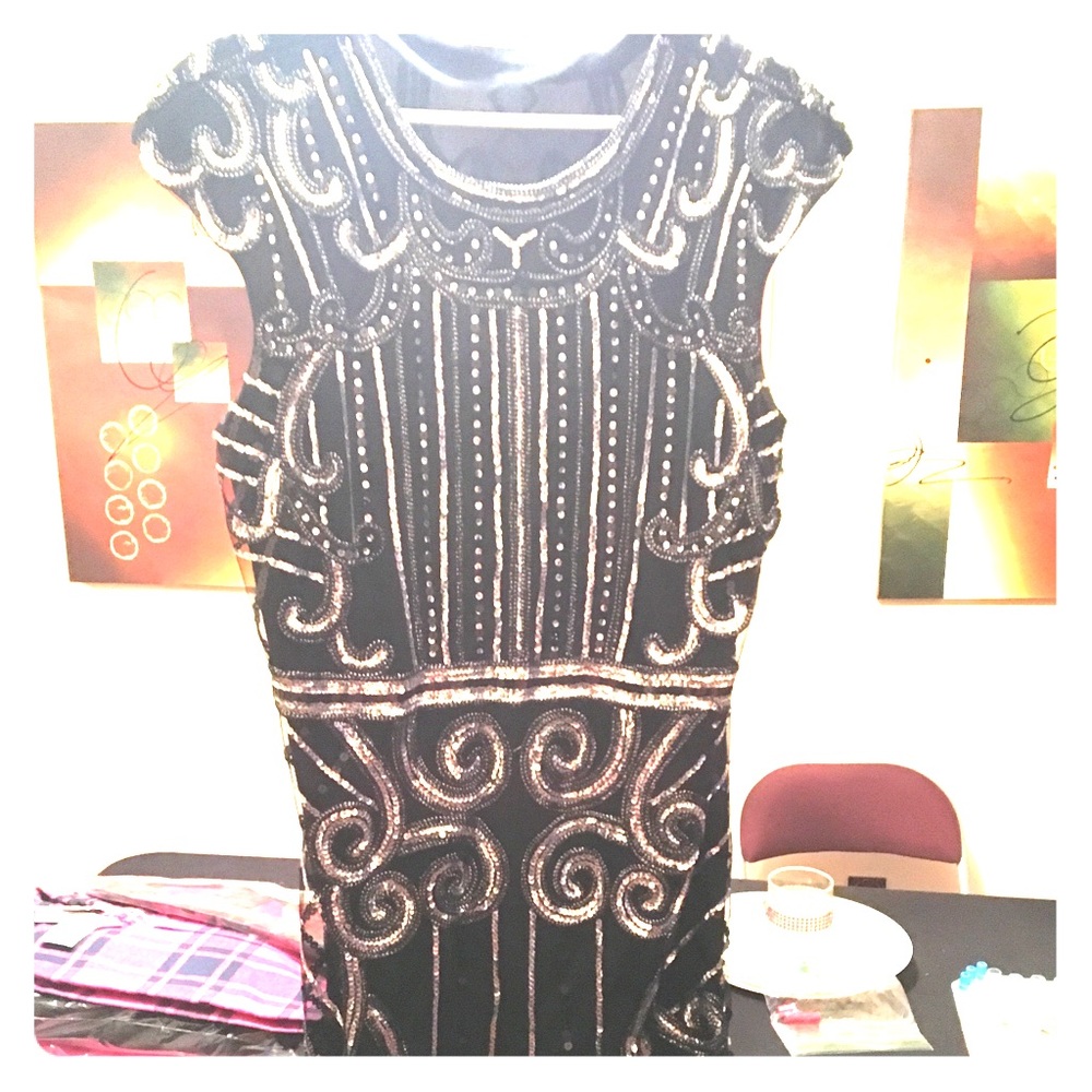 Black and silver dress with tassels on bottom