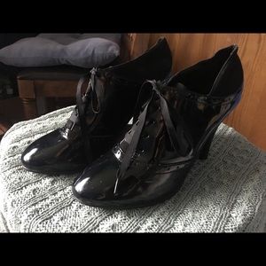 Shiny black oxford style heels