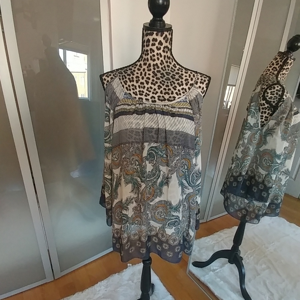 Sheer blouse with cut off shoulder