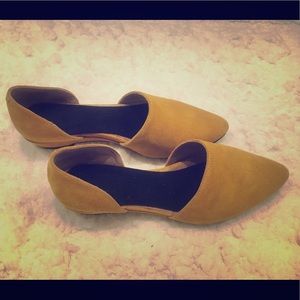 Suede pointy-toe loafers.