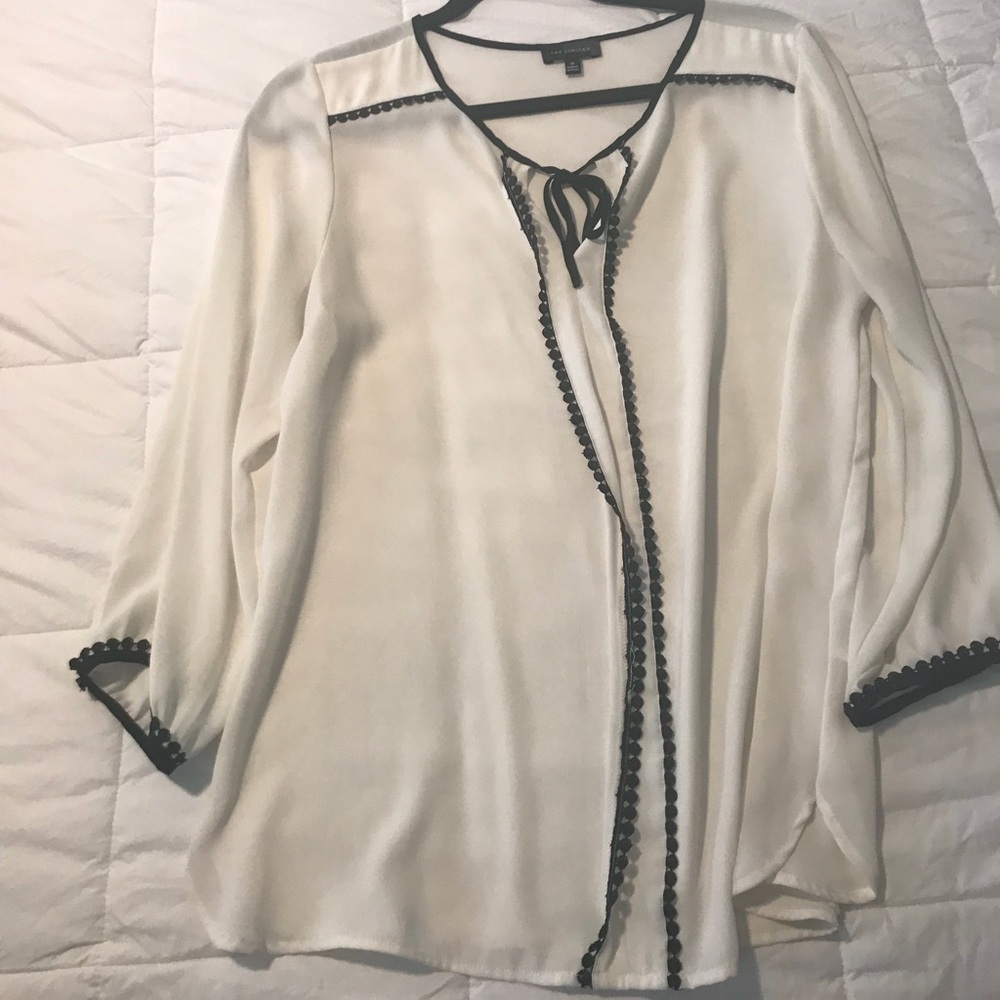 Limited White and Black trim Blouse.