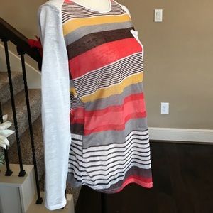 Cute stylish shirt, fits like a Large