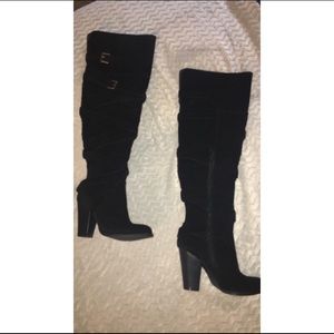 Black heeled knee high boots