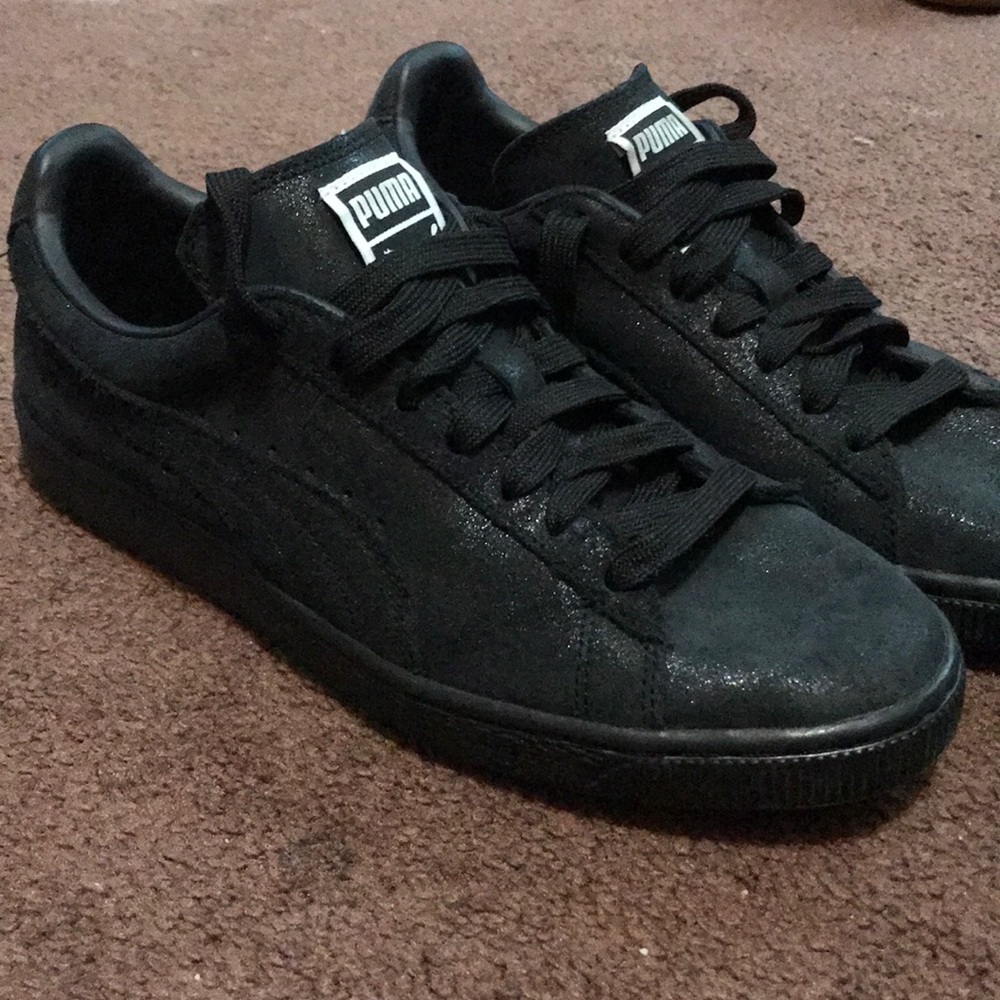 Puma black on black with a shimmery finish.