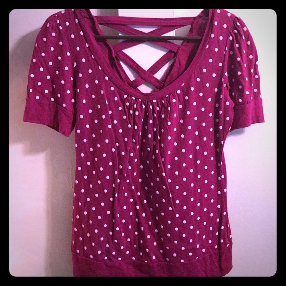 Purple top with white polka dots.
