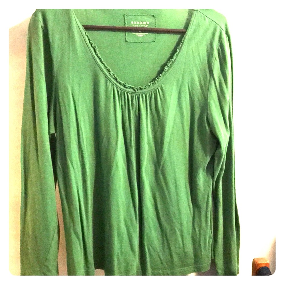 Green long sleeved shirt.