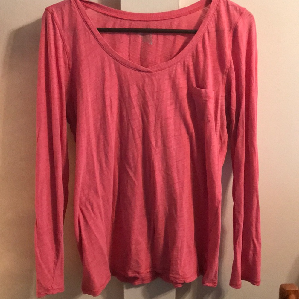 Pink long sleeve top.