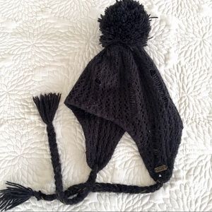Black Vans beanie with puffball and tassels