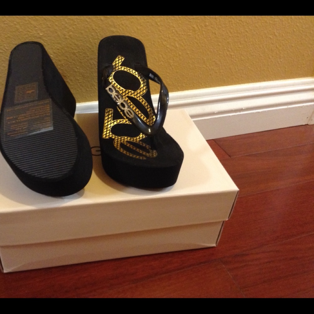 Bebe black logo repeat high flip flops