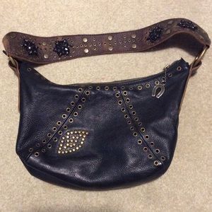 Betsy Johnson studded leather shoulder bag.