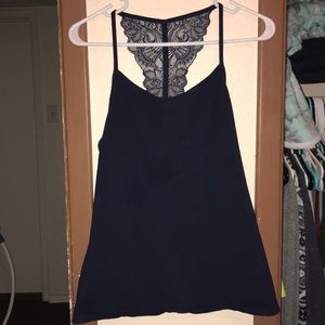 SOLD!! Beautiful navy tank top. With lace back.