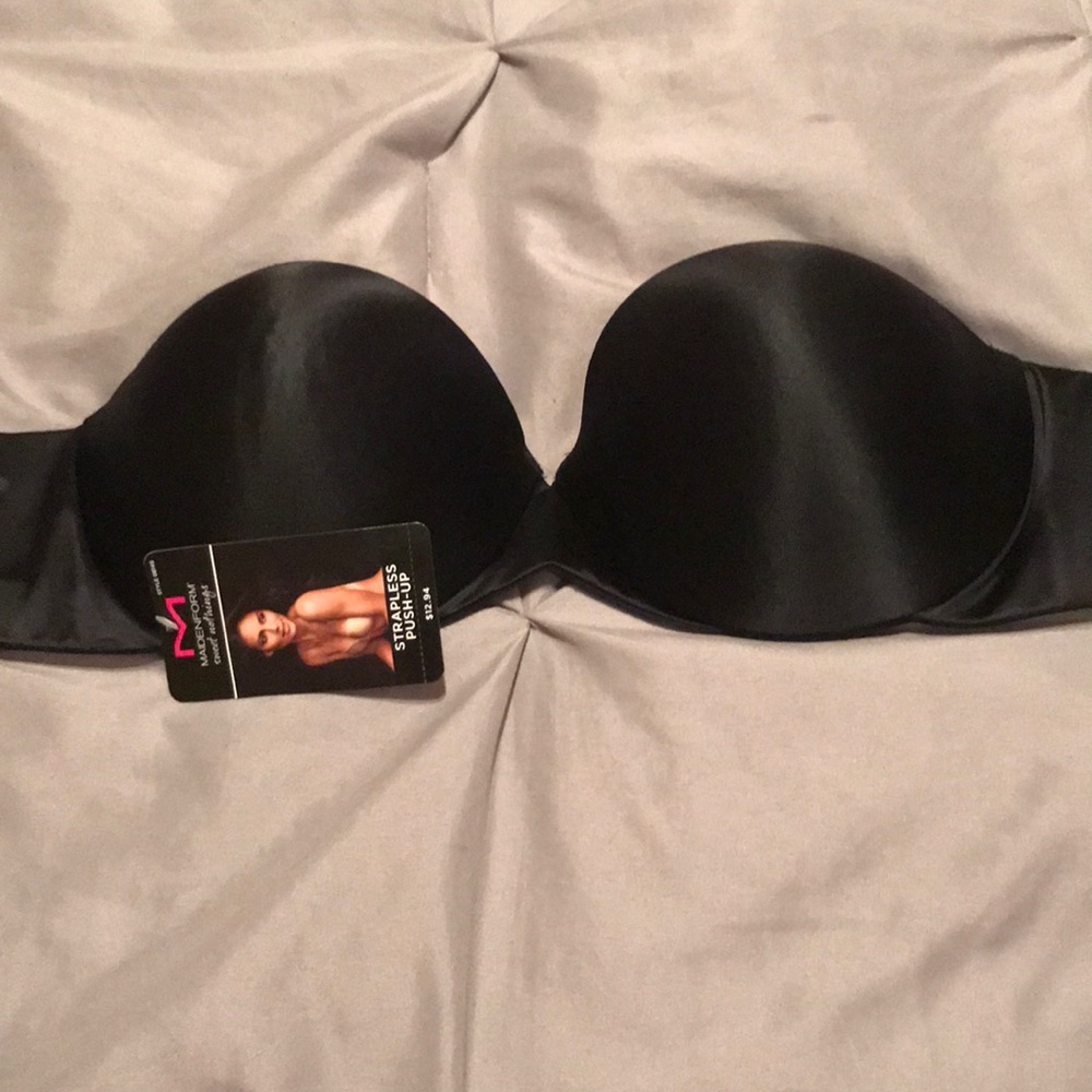 Two bras one Black strap less bra the other white brand pink