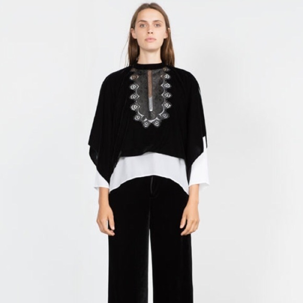 Velvet top with embroidered bib.