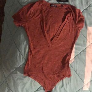 Brand new low v cut onesie