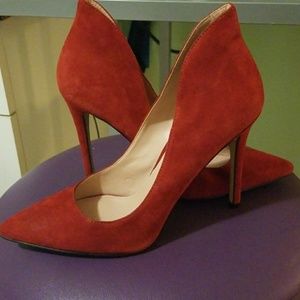 Red suede pumps