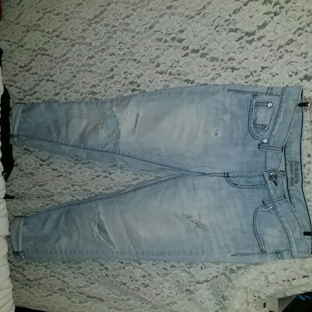 Distressed light blue jeans